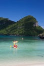 Traveler kayaking in the thai ocean from backward view