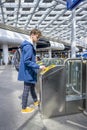 A traveler listening music and rushing to the platform