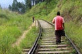 A traveler and a local meeting on the rail going to or from Ella