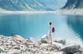 Traveler look at the mountain lake. Travel and active life concept. Adventure and travel in the mountains region in the Austria. Royalty Free Stock Photo