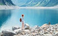 Traveler look at the mountain lake. Travel and active life concept. Adventure and travel Royalty Free Stock Photo