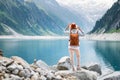 Traveler look at the mountain lake. Travel and active life concept. Adventure and travel Royalty Free Stock Photo