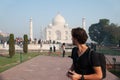 Traveler looking at Taj Mahal