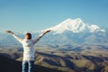 Traveler looking to Elbrus mountain