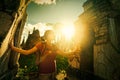 Traveler looks at sunset ancient Buddhist stupa of the temple co