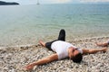 A traveler lying on a beach in enjoy it