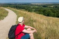 Traveler male relaxing meditation with serene view mountains landscape summer day.Relaxing middle age man in nature Royalty Free Stock Photo