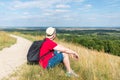 Traveler male relaxing meditation with serene view mountains landscape summer day.Relaxing middle age man in nature Royalty Free Stock Photo