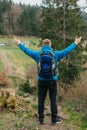 Traveler Man with backpack mountaineering Travel Lifestyle concept mountains on background Summer trip vacations outdoor Royalty Free Stock Photo