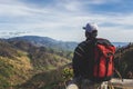 Traveler Man with backpack on mountains landscape on background Royalty Free Stock Photo