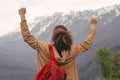 Traveler Man with backpack raised hands. mountains landscape on background Royalty Free Stock Photo