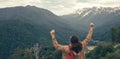 Traveler Man with backpack raised hands. mountains landscape on background Royalty Free Stock Photo