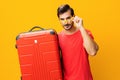 Journey man suitcase weekend vacation happy trip flight traveler background studio yellow guy baggage travel Royalty Free Stock Photo