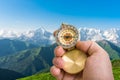 Traveler man with compass seeking a right way in the mountains Royalty Free Stock Photo