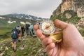 Traveler man with compass seeking a right way in the mountains Royalty Free Stock Photo