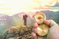 Traveler man with compass seeking a right way in the mountains Royalty Free Stock Photo