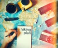 Traveler makes a trip hiking plan. camping gear, top view Royalty Free Stock Photo