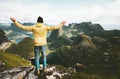 Traveler man happy raised hands on the mountain top Royalty Free Stock Photo