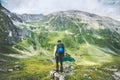 Traveler man hiking alone in mountains adventure active lifestyle Royalty Free Stock Photo