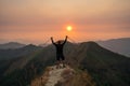 Traveler man hiking enjoying in the mountains with backpack at Khao Chang Puak mountain Thailand Royalty Free Stock Photo