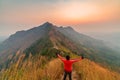 Traveler man hiking enjoying in the mountains with backpack at Khao Chang Puak mountain Thailand Royalty Free Stock Photo