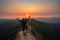 Traveler man hiking enjoying in the mountains with backpack at Khao Chang Puak mountain Thailand Royalty Free Stock Photo