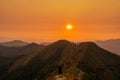 Traveler man hiking enjoying in the mountains with backpack at Khao Chang Puak mountain Thailand Royalty Free Stock Photo