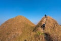 Traveler man hiking enjoying in the mountains with backpack at Khao Chang Puak mountain Thailand Royalty Free Stock Photo