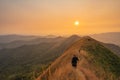 Traveler man hiking enjoying in the mountains with backpack at Khao Chang Puak mountain Thailand Royalty Free Stock Photo