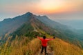Traveler man hiking enjoying in the mountains with backpack at Khao Chang Puak mountain Thailand Royalty Free Stock Photo