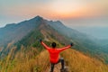 Traveler man hiking enjoying in the mountains with backpack at Khao Chang Puak mountain Thailand