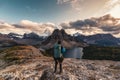 Traveler man hiking on Nublet peak with Assiniboine mountain and lake at provincial park Royalty Free Stock Photo