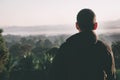 Traveler man looking a sunrise ,fog and landscape on a top of a mountain Royalty Free Stock Photo