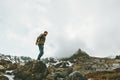 Traveler Man standing alone at foggy mountains Royalty Free Stock Photo