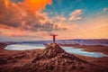 Traveler man wear red clothes and raising arm standing on the peak of mountain near Lake Baikal, Siberia, Russia Royalty Free Stock Photo