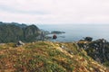 Professional expeditor standing on the edge cliff rock and looking forward away Royalty Free Stock Photo