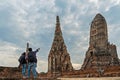 Traveler man and women with backpack walking in asia temple Ayuttaya, tourists travel in Thailand. Royalty Free Stock Photo