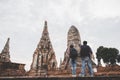 Traveler man and women with backpack walking in temple Ayuttaya