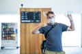 Traveler with mask stuck in airport no able to return home country due to COVID-19 border closures Royalty Free Stock Photo