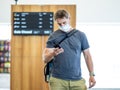 Traveler with mask stuck in airport no able to return home country due to COVID-19 border closures Royalty Free Stock Photo