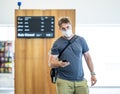 Traveler with mask stuck in airport no able to return home country due to COVID-19 border closures Royalty Free Stock Photo