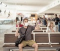 Traveler with mask stuck in airport no able to return home country due to COVID-19 border closures