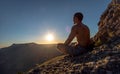 Traveler meditate on mountain