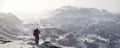 Traveler with a backpack on top of snow mountains