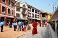 Traveler and Nepalese people on Street of Boudhanath temple go to Bodnath Stupa for pray in Kathmandu. Royalty Free Stock Photo