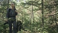 Traveler photographing scenic view in forest. One caucasian woman shooting nice magic look. Girl take photo video on