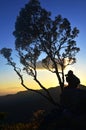 Traveler photographing during sunset