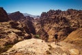 Traveler with raised hand impressed amazing view. Meditation nature. Achievement concept. Ecotourism. Copy space. Rocky mountain l Royalty Free Stock Photo