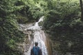 Traveler Reached Destination And Enjoys View Of Waterfall, Rear View Travel Hiking Concept Royalty Free Stock Photo