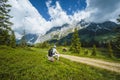 Traveler resting on hiking trail enjoying Wilder Kaiser mountains, Tirol - Austria Royalty Free Stock Photo
